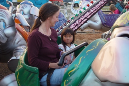 Kasen and Mommy riding at the county fair